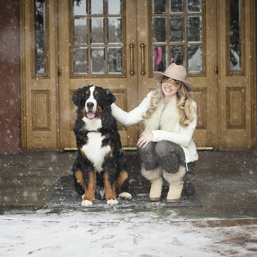 Women with dog in the snow.