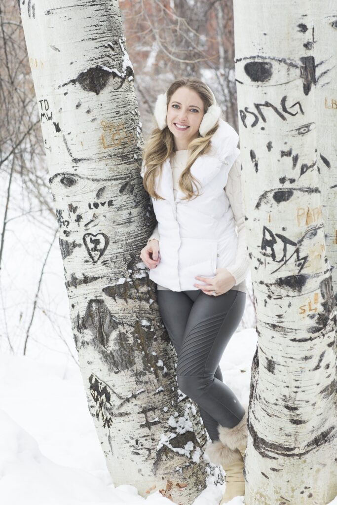 Jen with aspen trees in winter.